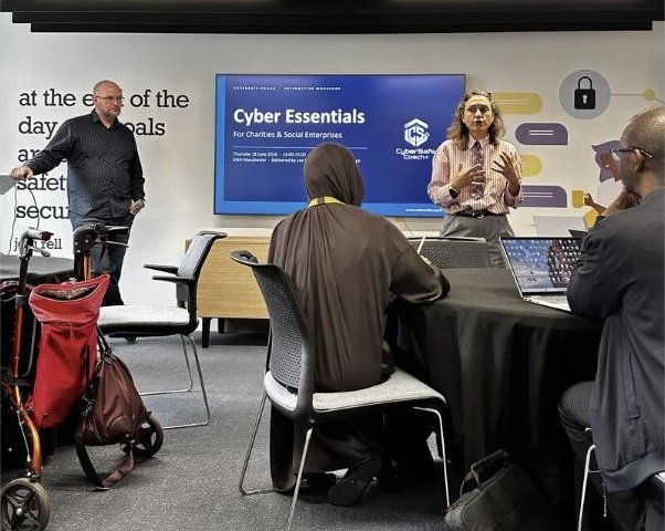 Our Cyber Essentials Lab at DiSH Manchester, with the CyberSafe Coach slide on screen